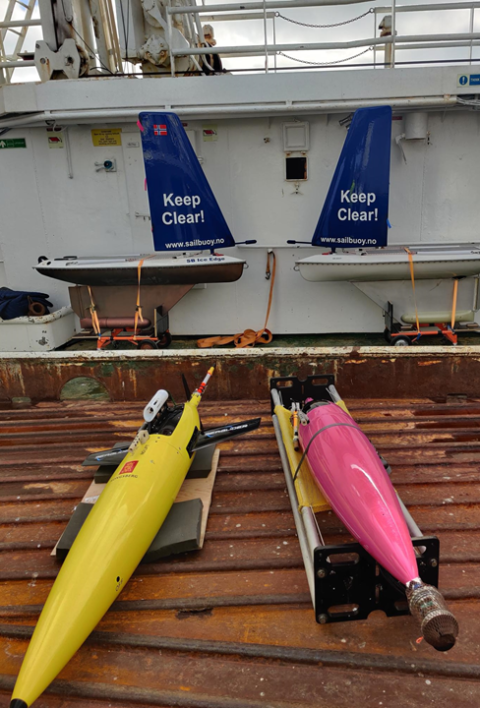 Two Seagliders on a ship's deck beside Sailbuoys